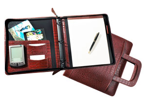 zippered binder made of red crocodile-grained Italian leather